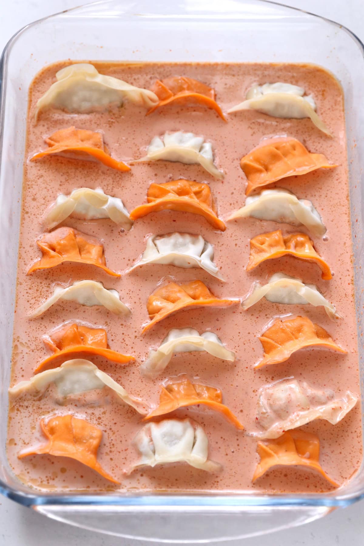 Dumplings added to dish.