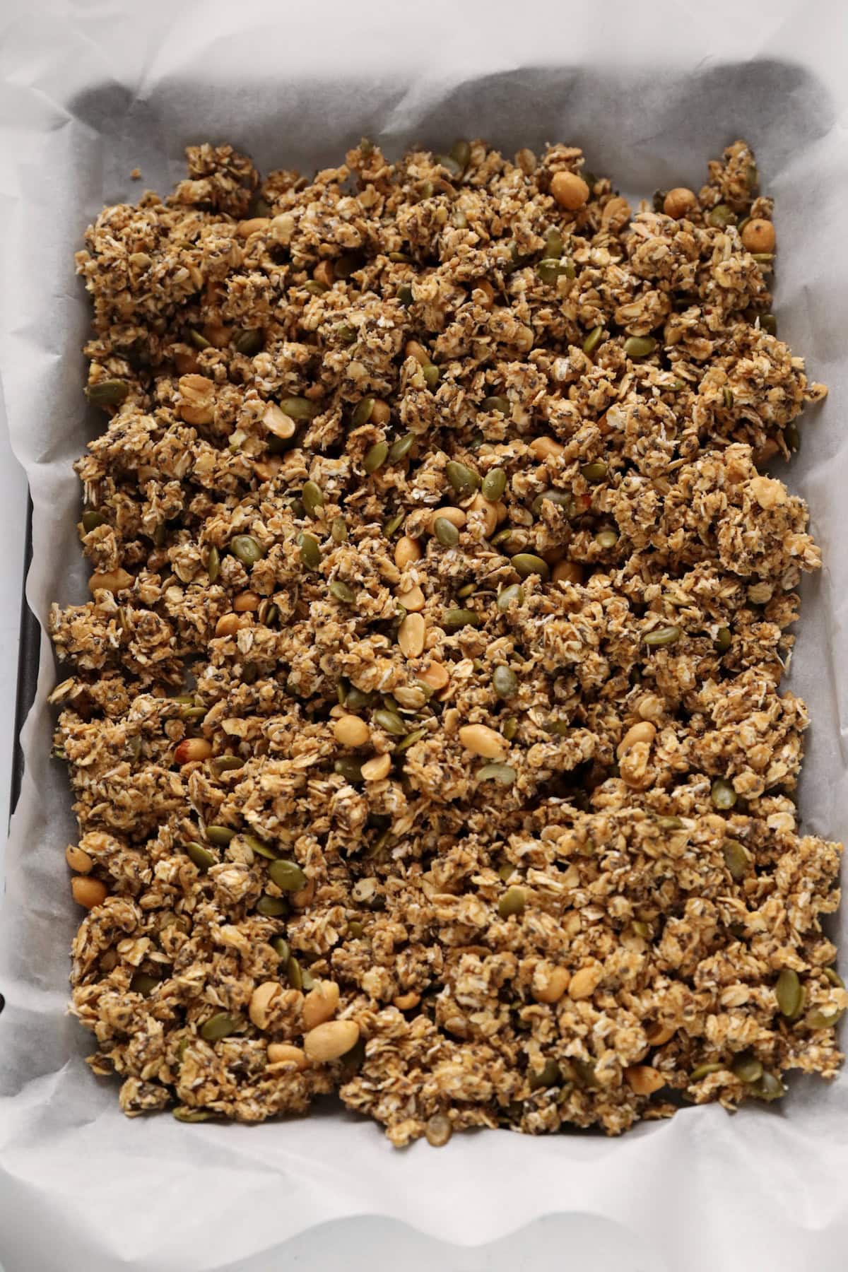 granola mixture in baking tray